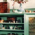 Bedroom cabinetry with ornate brass panel insets