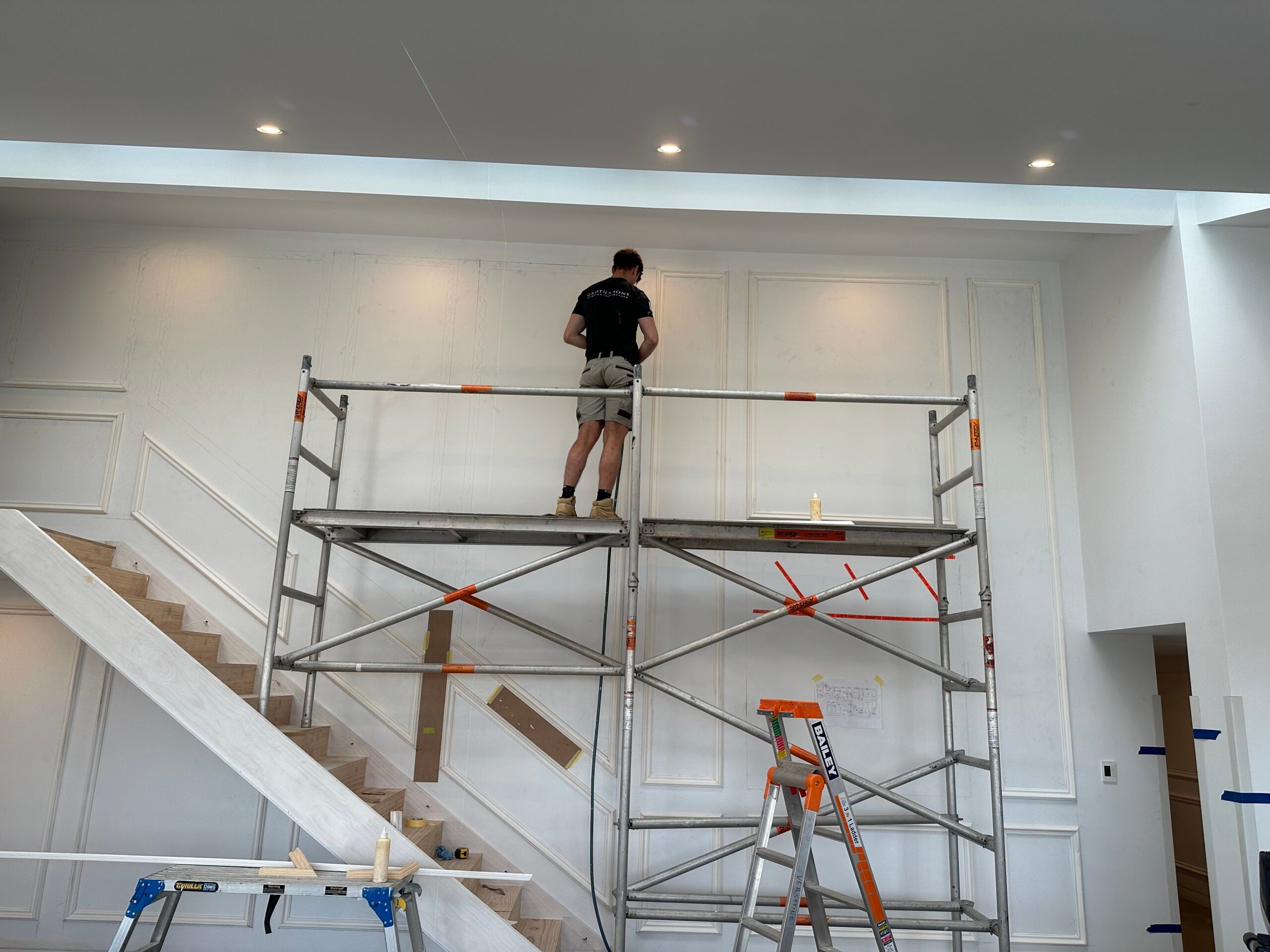 Oscar Groth – Interior Designer and Maker Oscar Groth setting out custom wall panelling during the construction of a residential interior project.