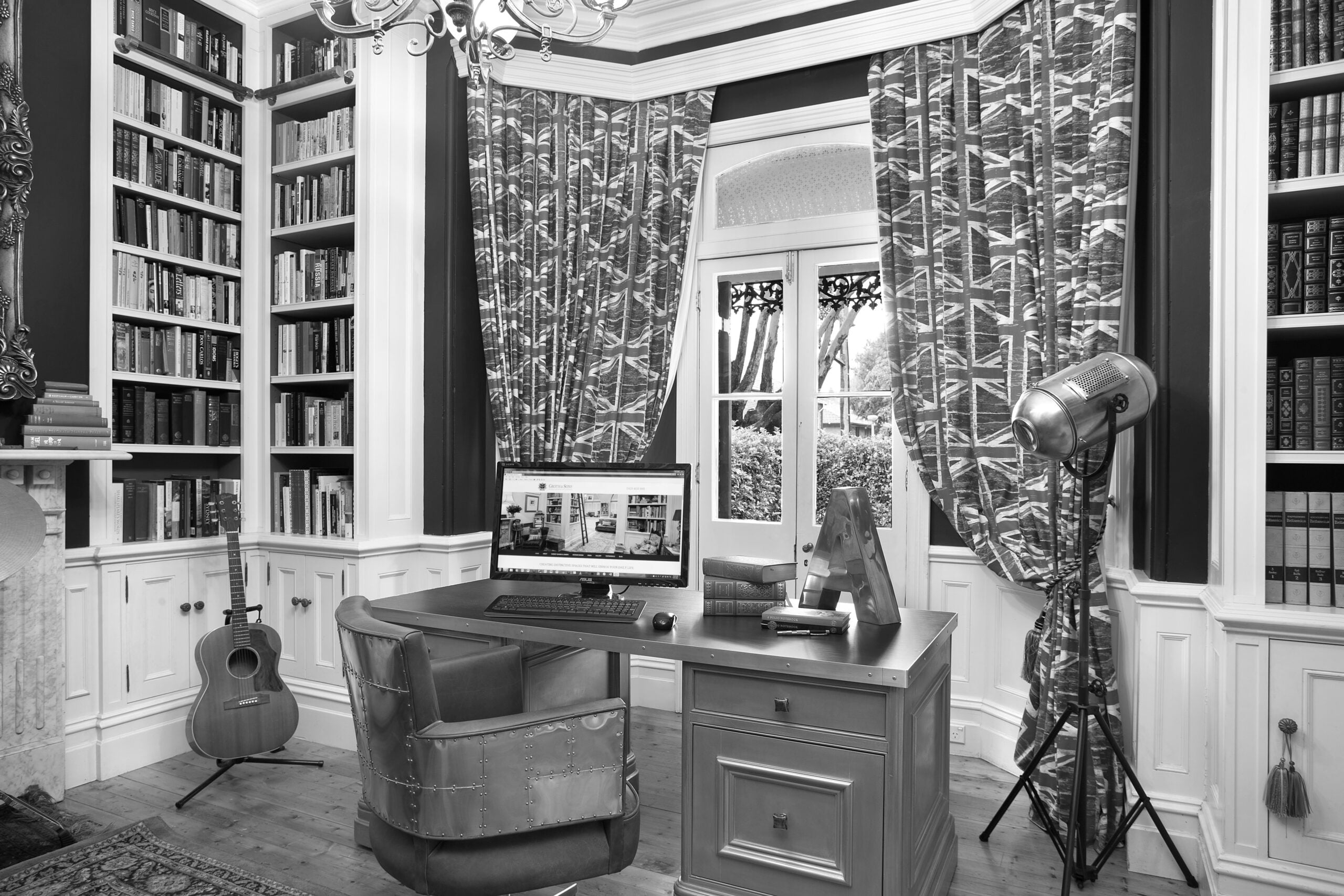 Amos Groth's home library and study, featuring bespoke bookcases designed by Groth & Sons.